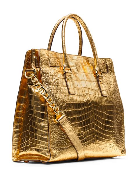 gold michael kors purse|Michael Kors large gold tote.